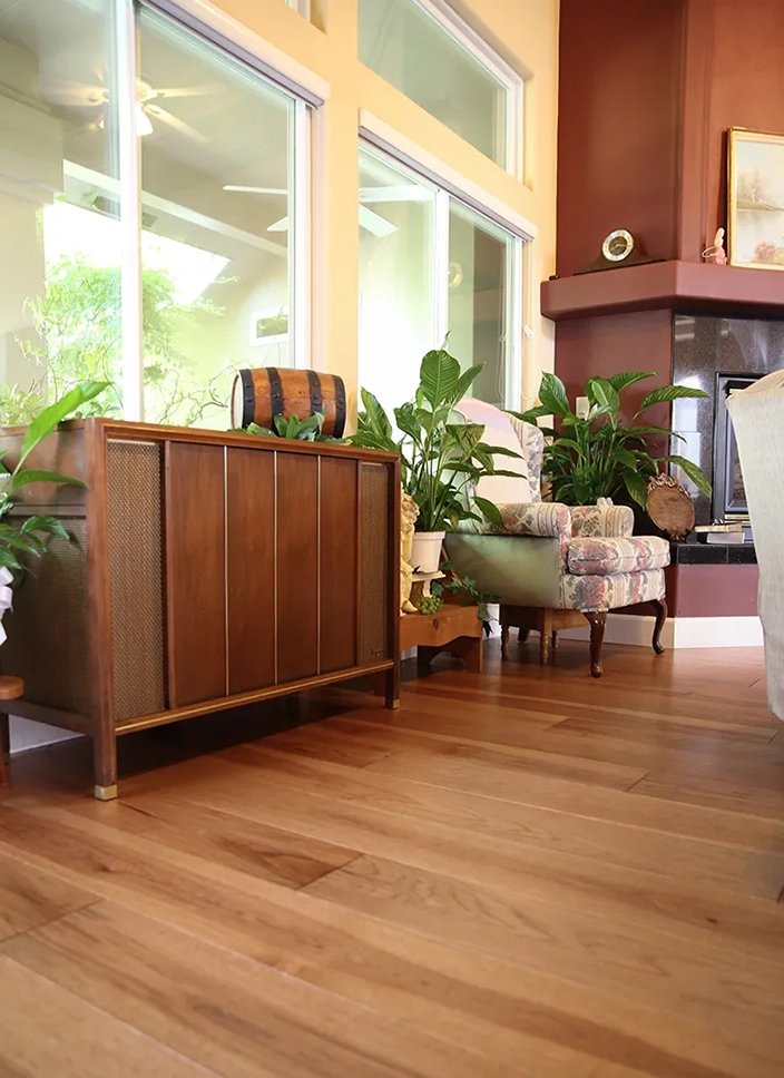 Room with window looking out to garden with beautiful hardwood flooring