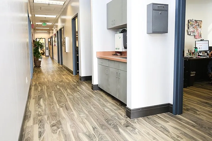 Hallway with waterproof vinyl flooring for Coyote Corner, Lemoore, CA