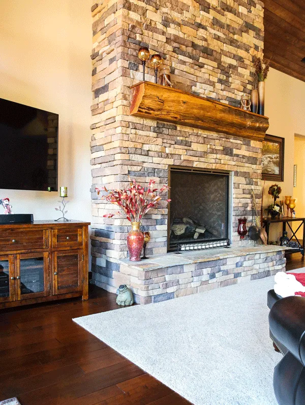 Beautiful stone fireplace with Karastan carpet beneath