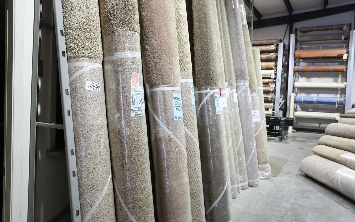 Rolls of carpet in warehouse