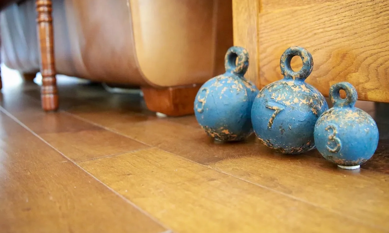 Decorative blue objects on distressed wood flooring in Hanford, CA