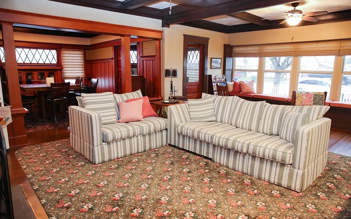 Two striped sofas in historic home