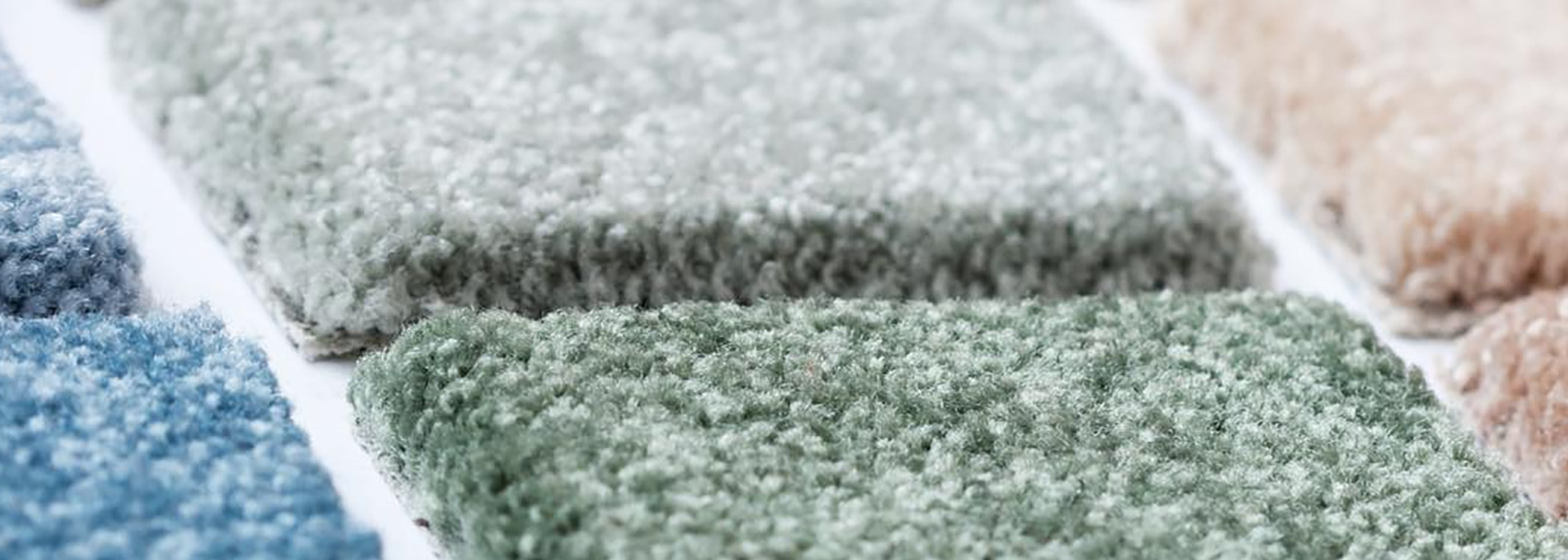 Samples of Blue, Green, and Beige Carpeting