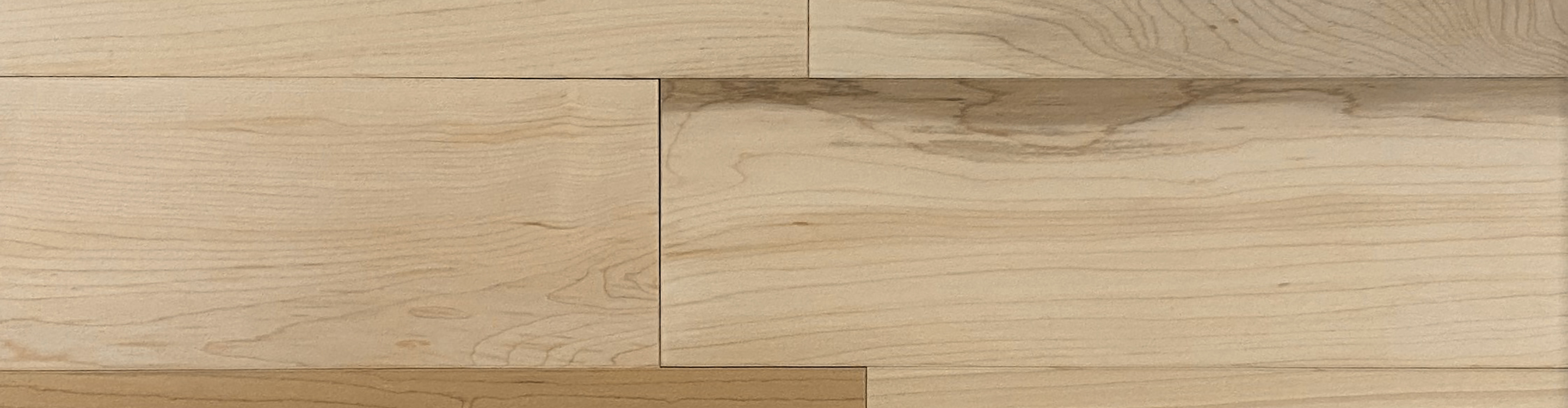 Close up of maple colored engineered hardwood plank flooring