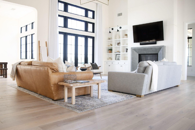 Light colored hardwood flooring in beautiful living room with lots of light.