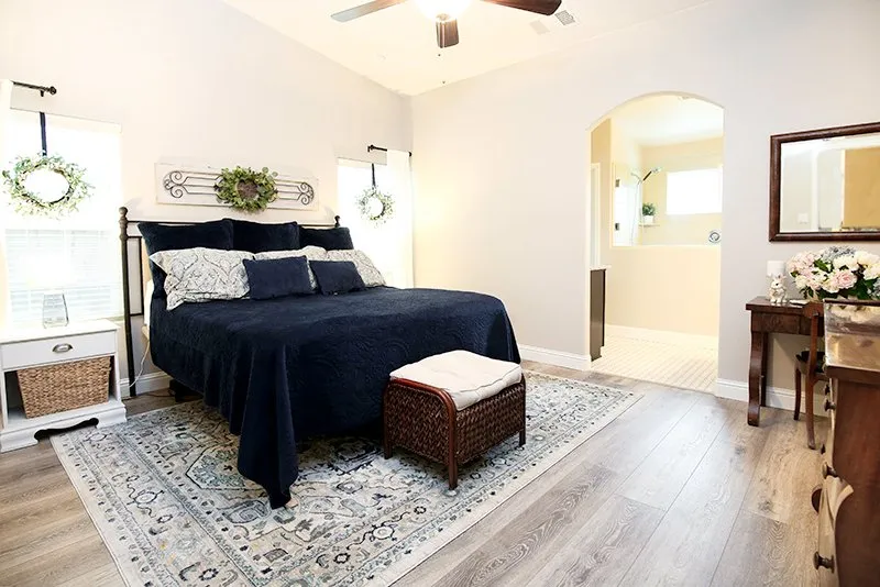 Bedroom with wood-look flooring and area rug