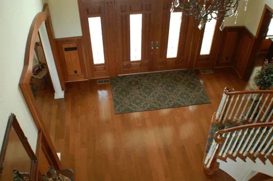 View of entryway flooring from top of staircase