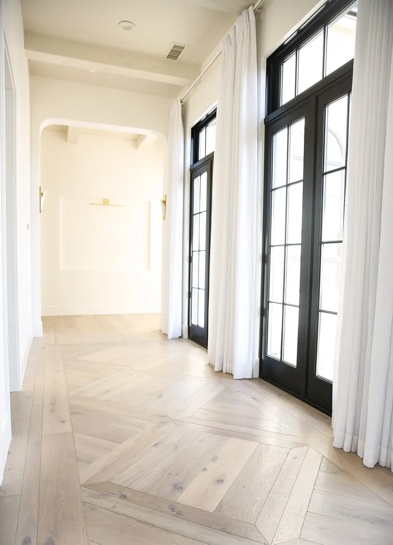 Hallway with French doors and parquet floors