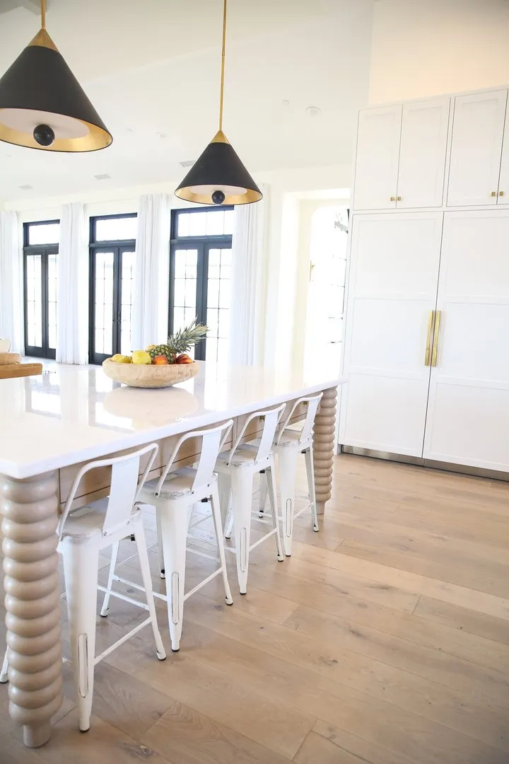 Kitchen high table with chairs on hardwood flooring, Hanford, California