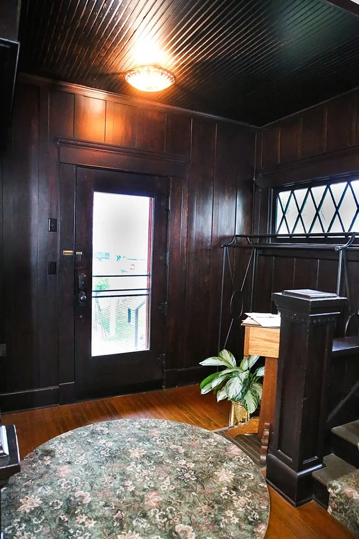 Entryway with circle green and pink floral carpet