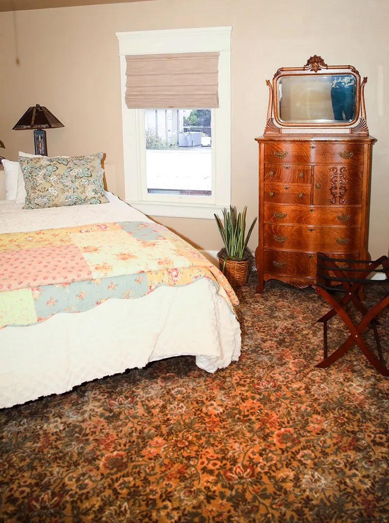 Bedroom with sunflower floral carpeting