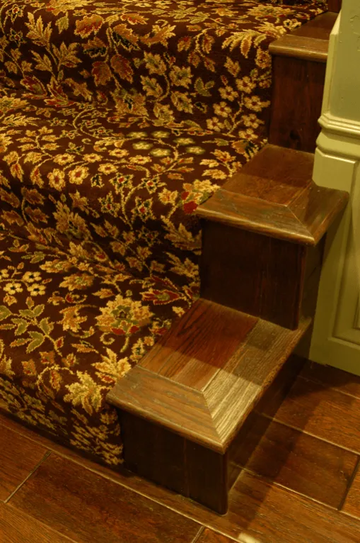 Dutch Royal Carpet expertly inlaid on hardwood staircase