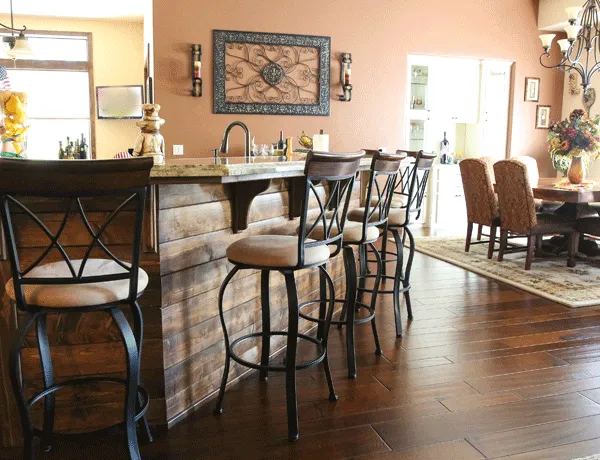 Wooden bar with bar stools on Maple hardwood plank flooring