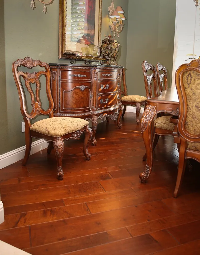 Extra dining room chair and cabinet on hardwood flooring in dining room
