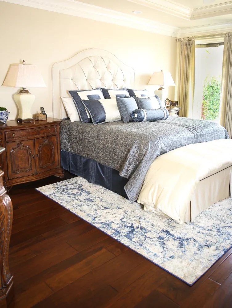 Bedroom with area rug on hardwood flooring