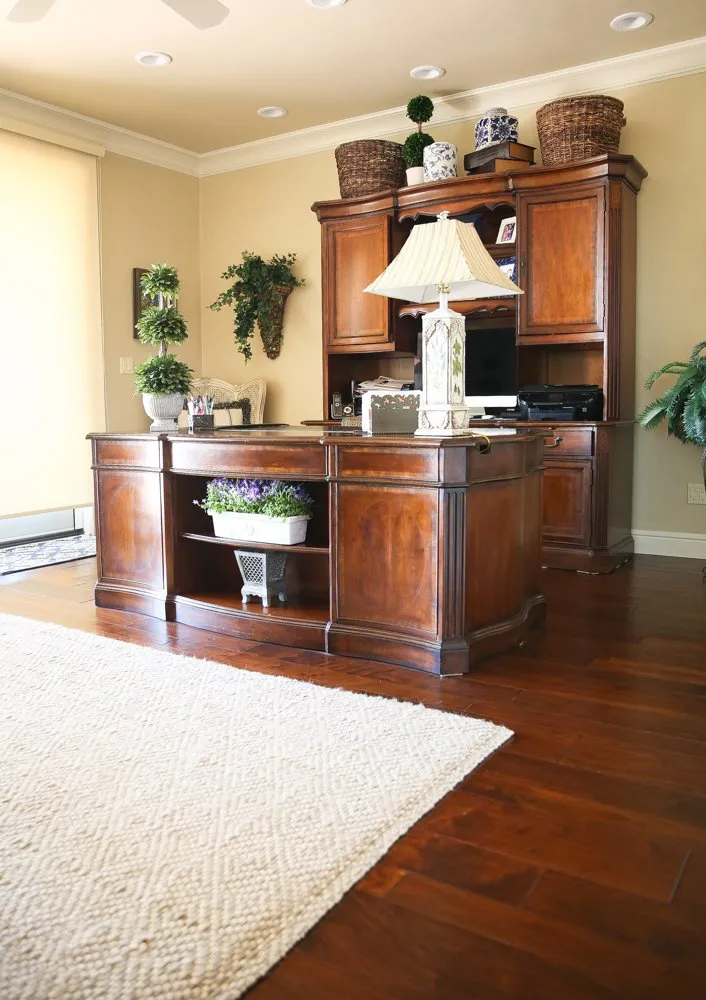 Office with rich wood desk on dark hardwood flooring, Fresno, CA