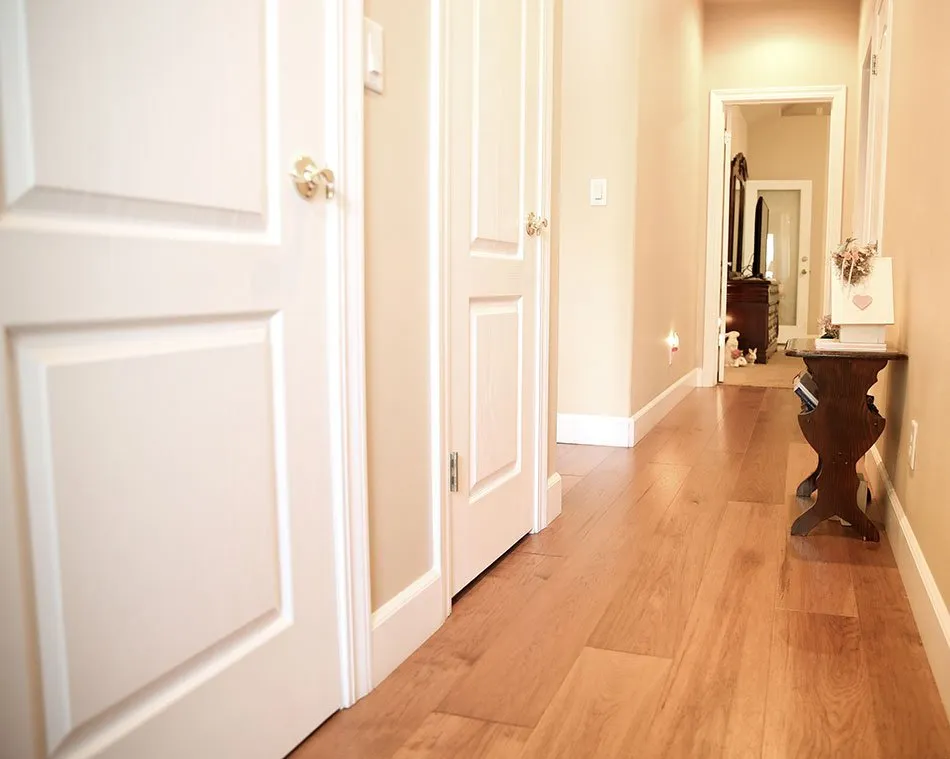 Hallway with pretty hardwood flooring