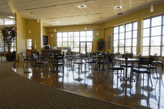 Commercial carpet transitions to vinyl plank flooring in dining area, Porterville, CA