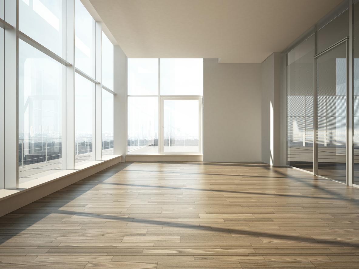Office lobby area with walnut-colored luxury vinyl plank flooring