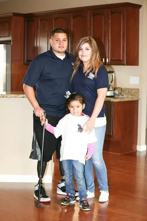 Fidel and Daisy Bobadilla with their daughter